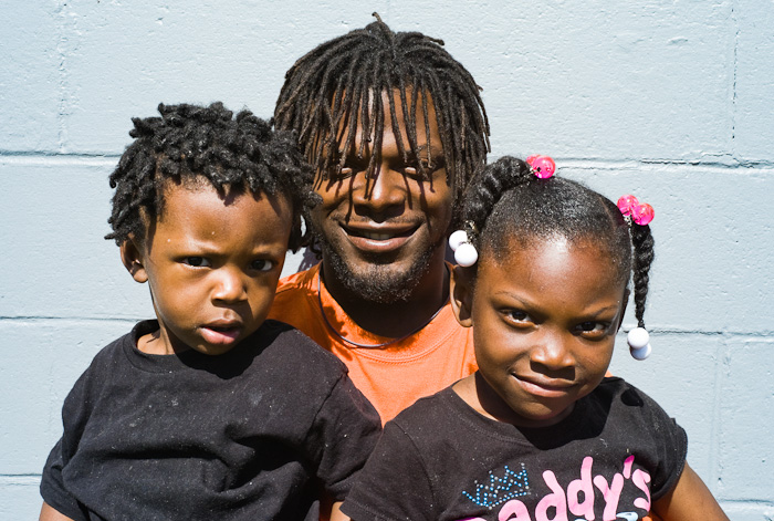 Kevin Hall, of New Orleans, Louisiana, with his son and daughter.  (© Lewis Kostiner)