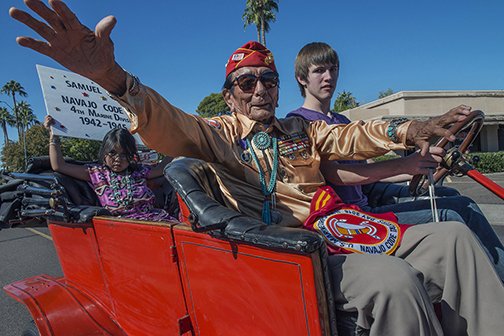 One of the last surviving World War II Navajo code talkers waving to the crowd at the Veteran’s Day Parade, Phoenix, AZ (2015).
