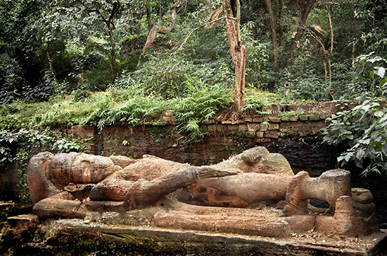 This statue of a reclining Vishnu in Bandhavgarh National Park was sculpted during the tenth century.  (© Joan Myers)