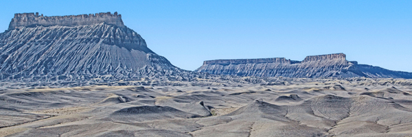 Factory Butte (left foreground) and nearby mesas.