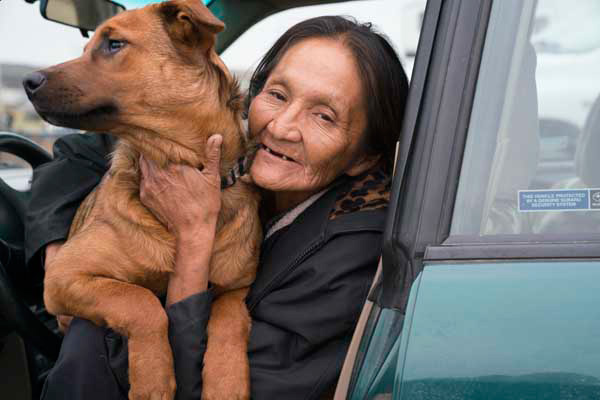 A Lakota Water Protector and her dog. 